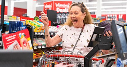 Joyful shopper at the cash register.