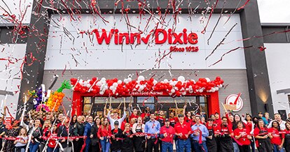 Crowd of people cheering and celebrating on the storefront of the Winn-Dixie at Grand Cypress neighborhood in St. Johns County, Jacksonville.