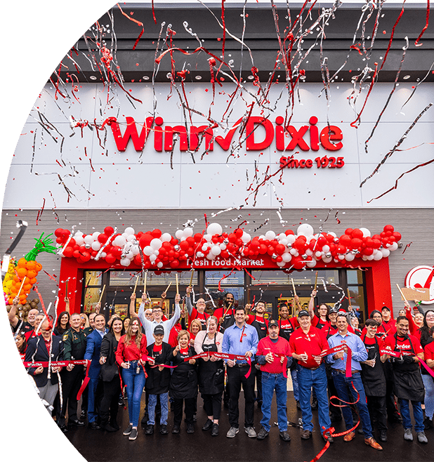 Crowd of people cheering and celebrating on the storefront of the Winn-Dixie at Grand Cypress neighborhood in St. Johns County, Jacksonville.