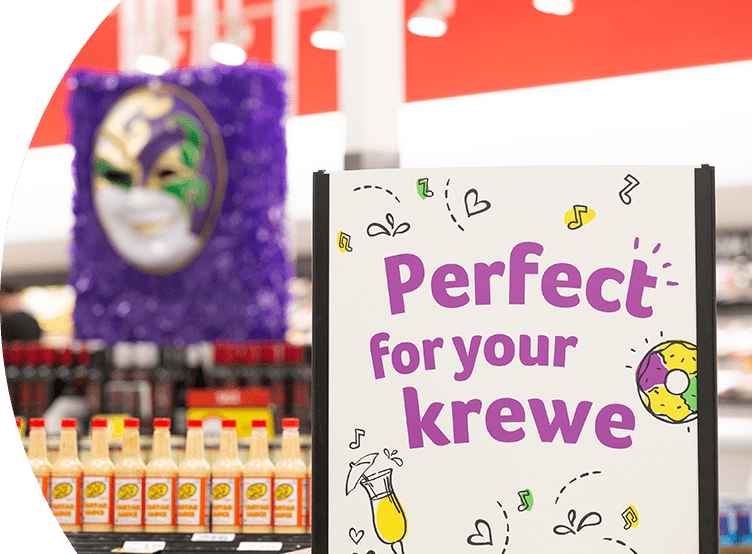 Mardi Gras signage inside a Winn-Dixie store that reads "Perfect for your krewe".