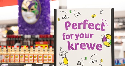 Mardi Gras signage inside a Winn-Dixie store that reads "Perfect for your krewe".