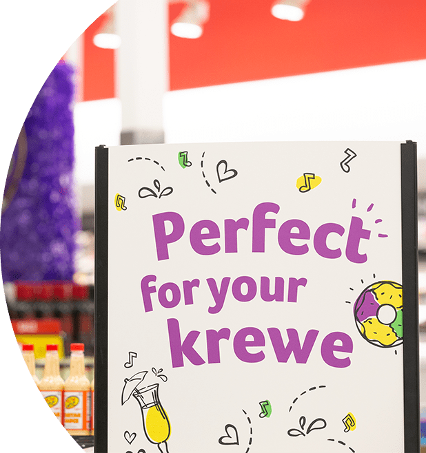 Mardi Gras signage inside a Winn-Dixie store that reads "Perfect for your krewe".