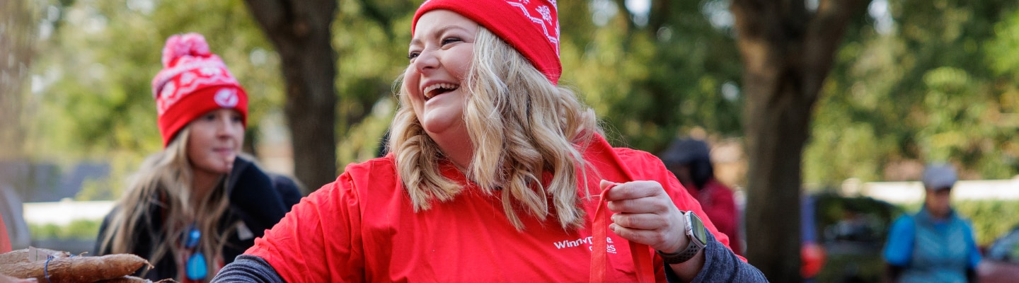 WInn-Dixie associate joyfully smiling.